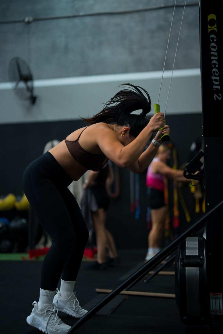 Member powering through a ski erg interval