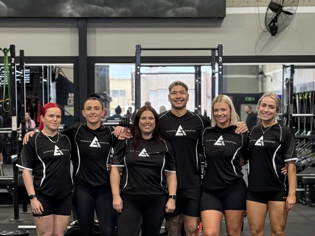 The Elevate Athletica coaching team on the gym floor